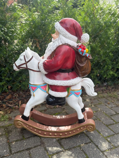 Kerstman - Kerstman op schommelpaard - 85 cm hoog