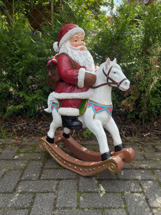 Kerstman - Kerstman op schommelpaard - 85 cm hoog